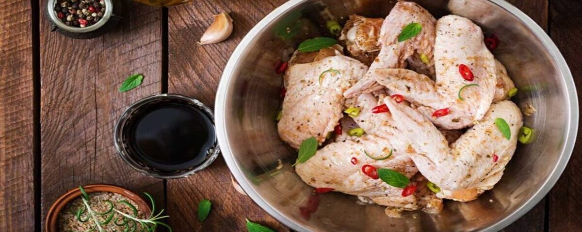 Fresh spring chicken prepared alongside its sauces and ingredients