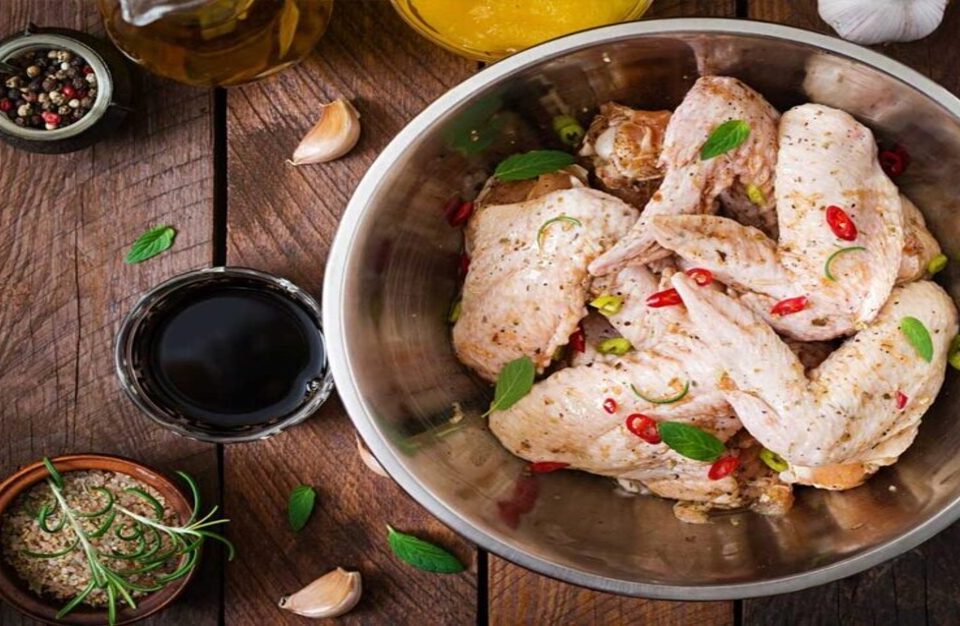 Fresh spring chicken prepared alongside its sauces and ingredients